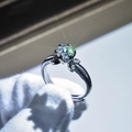 Macro shot of silver ring with six-prong set solitaire diamond and leaf detail - Adjustable Open / Exquisite Petal Shape Style (7)