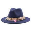 Detail of navy blue wool fedora featuring bohemian tassels and sea shell decorative band - Navy Blue