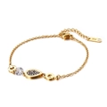 Bracciale minimalista in titanio dorato con zircone a goccia e ciondolo a maglia G - Oro