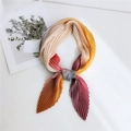 Pleated square scarf featuring a multicolor gradient design in elegant accordion folds - Gradient Pink Yellow