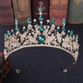 Detailed view of Baroque bridal tiara with green emerald stones and silver rhinestones - Gold with Green Rhinestones