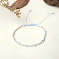 Detail of handmade blue seed beads and freshwater pearls bracelet with adjustable cord - Light Blue Style (BR0304)