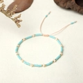 Close-up of handmade blue seed bead bracelet with pearls and adjustable woven cord - Sky Blue Style (BR0307)