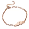 Détail du bracelet en acier inoxydable or rose avec trois breloques silhouette d'éléphant - Or rose