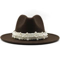 Detailed view of the layered white pearls decorating the brim of a brown wool fedora hat - Coffee
