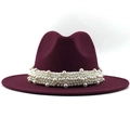Close-up of elegant burgundy wool fedora hat featuring detailed white pearl band decoration - Burgundy