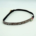Diadema brillante de strass con botones de madera florales para proteger orejas sobre gris - Champaña