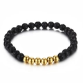 Pulsera minimalista de cuentas de lava negra con cinco cuentas de acento doradas - Dorado