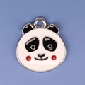 Macro shot of an enamel panda head alloy pendant with pink cheeks and silver hook - Panda 19