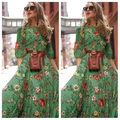 Close-up of green floral maxi dress featuring a brown leather belt and matching accessory - S / Green