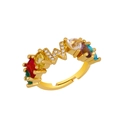 Detailed shot of adjustable gold ring with multi-colored crystals and W-shaped pavé accents - Adjustable Open / Letter W
