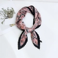 Pleated square neck scarf with pink and black paisley floral pattern in a knot style - Paisley Wave Black