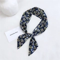 Dark blue cotton linen scarf with green leaf print tied as a stylish headband - Bamboo Leaf Navy Blue