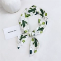 Long silk scarf with green cactus print tied as bow on white background - Cactus White