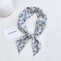 Beige cotton-linen scarf with blue leaf patterns tied for styling on a white background - Bamboo Leaf Gray
