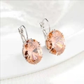 Macro detail of champagne oval gemstones with silver leverback earrings - Champagne