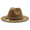 Detailed view of camel wool hat with shell accents and woven ethnic decorative band - Camel