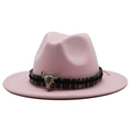 Close-up of pink wool fedora hat with ethnic woven band and silver bull skull ornament - Pink