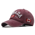 Detail of burgundy cotton baseball cap with Canada 1867 embroidery and flag patch - Burgundy
