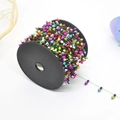 Colorful bulb-shaped decorative beads on a spool for festive Christmas ornaments - Plated Multi-color Christmas Bulb Bead Garland