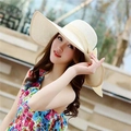 Detail of a beige woven sun hat with a large side bow and elegant wavy wide brim - M (56-58cm) / Milk White