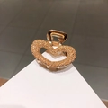 Elegant gold heart hair claw clip with rose embossed pattern on a geometric stand - 10# Heart Shape