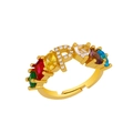 Macro view of gold adjustable ring featuring letter R with colorful inlaid gemstones - Adjustable Open / Letter P
