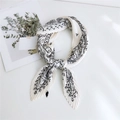 Pleated white silk scarf with black star pattern for women's fashion styling - Celestial White Background