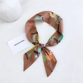 Brown cotton-linen long scarf with cartoon sloth pattern tied in a bow on white background - Sloth Brown