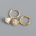 Macro detail of gold-plated S925 silver shell earrings featuring micro-pave zirconia stones - Yellow Gold Color (Pair)