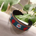 Detail of navy blue wide headband featuring ethnic floral embroidery and heart patterns - Standard Type / Peach Heart