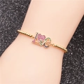 Bracciale a sfere dorate con ciondolo LOVE a cuore in zirconi colorati al polso - Catena Box LOVE