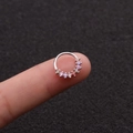 Rainbow cubic zirconia nose ring in silver finish held on fingertip for scale - 3# 8mm Top-Mounted Zirconia