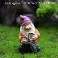 Miniature garden gnome statue with purple hat and scissors made of resin 4.8cm height - Gnome with Scissors