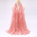 Detail view of light pink candy-colored voile scarf with soft drape on a mannequin - Light Green