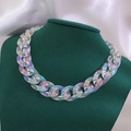 Chunky colorful acrylic link chain necklace with iridescent finish on green model bust - Transparent Holographic Style / AB Color