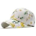 Close-up of stylish lace baseball cap with yellow and green floral patterns on white fabric - Adjustable / Yellow