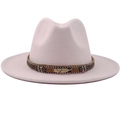 Detail of light pink fedora hat featuring a woven band and golden feather pendant - Pink