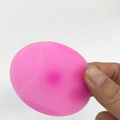Pink silicone facial cleansing brush with dual-texture massage bristles for pore cleaning - Translucent Rose Red
