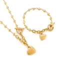 Set gioielli cuore dorato con collana a maglie di cuore e bracciale con chiusura a T - Set Cuore Traforato Dorato (KS140875-Z)