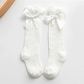 White mesh knit kids high socks with large satin bow accent for toddlers - White