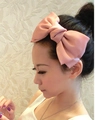 Side view of a large double-layer pink satin bow headband worn by a female model - Bow Headband / Korean Pink Headband