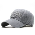 Close-up of deep gray washed cotton baseball cap with white NEW YORK 3D embroidery - Gray