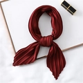 Detail of burgundy pleated satin scarf showing elegant silk-like texture and fine folds - Burgundy