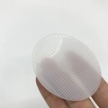 Translucent white silicone oval facial cleanser brush with dual-texture soft bristles - Clear