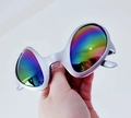 Futuristic silver daisy sunglasses with colorful iridescent lenses held by hand - Silver Alien
