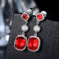 Elegant tiered red ruby pendant earrings in 925 sterling silver with sparkling accents - Red