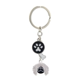 Silver metal keychain featuring a cyclops dog charm and black bone circular pendant - Pekingese