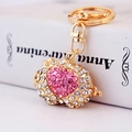 Golden zodiac pig keychain with sparkling crystals and a pink heart rhinestone detail - Pink Pig