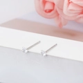 Detailed view of 3mm S925 sterling silver mini heart-shaped crystal stud earrings. - 3mm / Heart / White